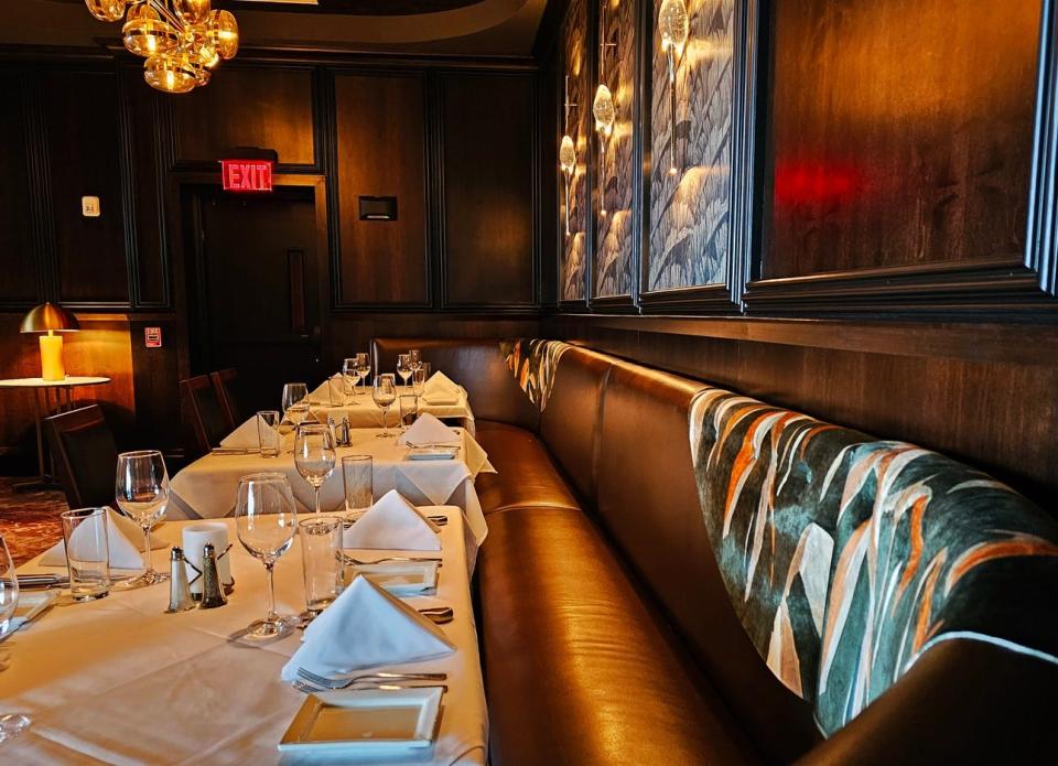 Behind the second-floor bar are a few booths for what feels like a private experience at Ruth's Chris Steak House in West Des Moines.