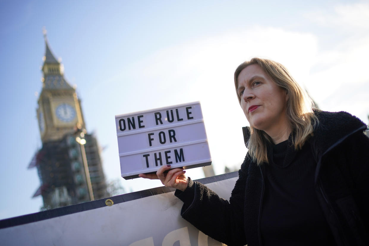 A protestor in Parliament Square in Westminster, London, as public anger continues following the leak on Monday of an email from Boris Johnson's principal private secretary, Martin Reynolds, inviting 100 Downing Street staff to a 