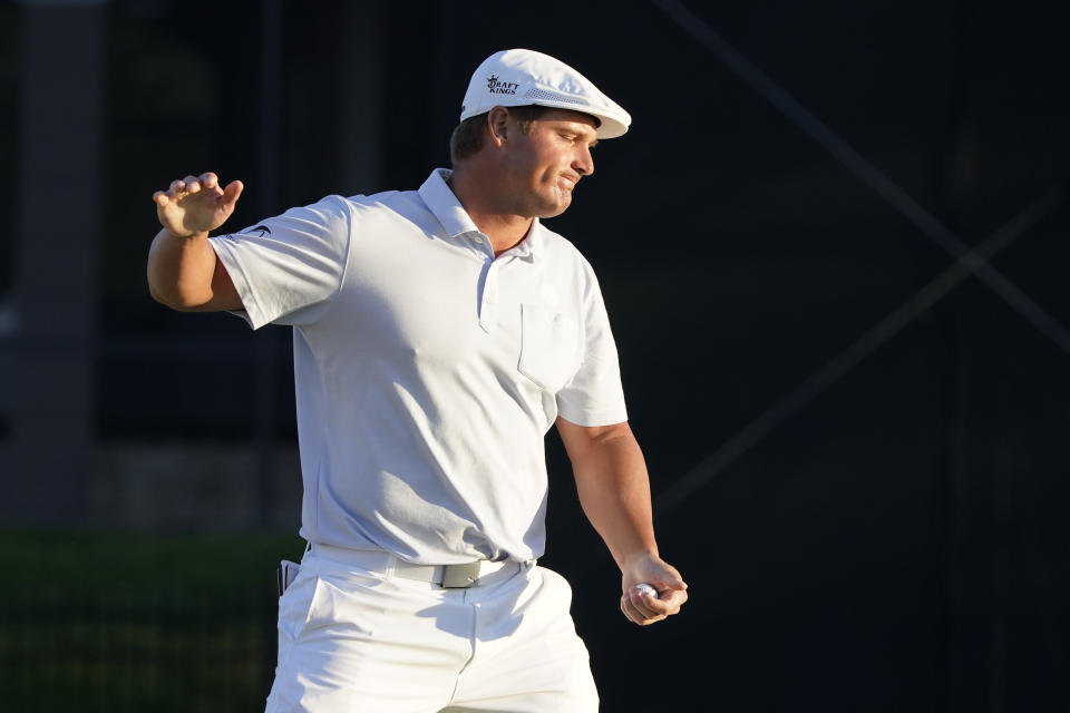 Bryson DeChambeau reacts after missing a putt on the 16th green during the final round of the Arnold Palmer Invitational golf tournament Sunday, March 7, 2021, in Orlando, Fla. (AP Photo/John Raoux)