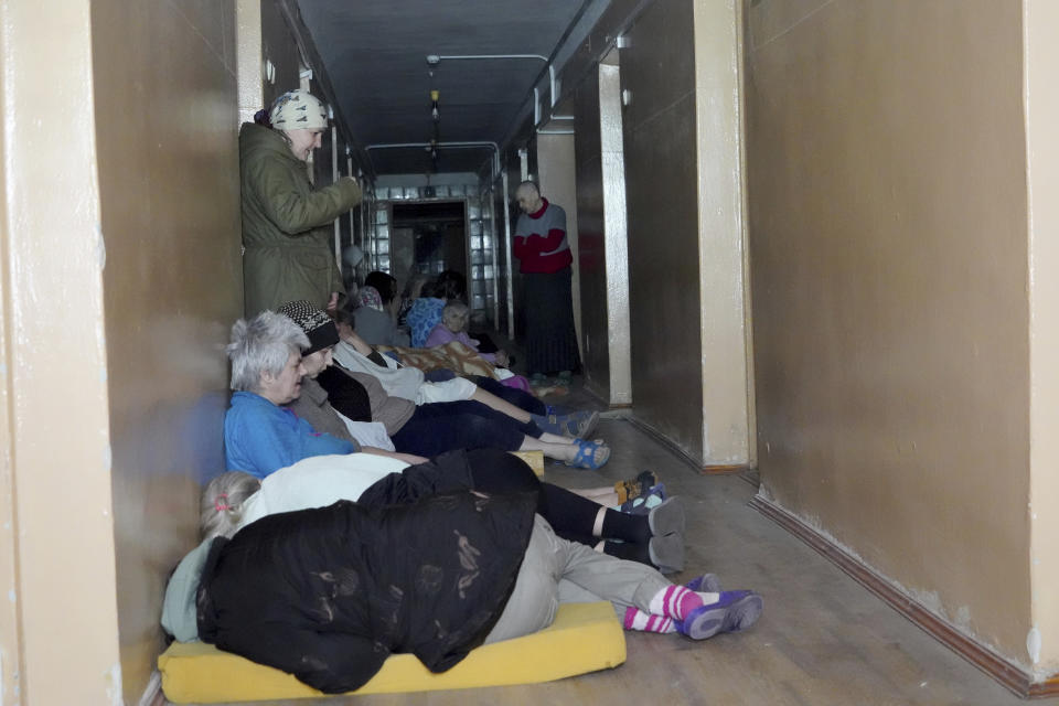 Patients take cover after a Russian attack on mental hospital №3 in Kharkiv, Ukraine, Saturday, April 27, 2024. (AP Photo/Andrii Marienko)