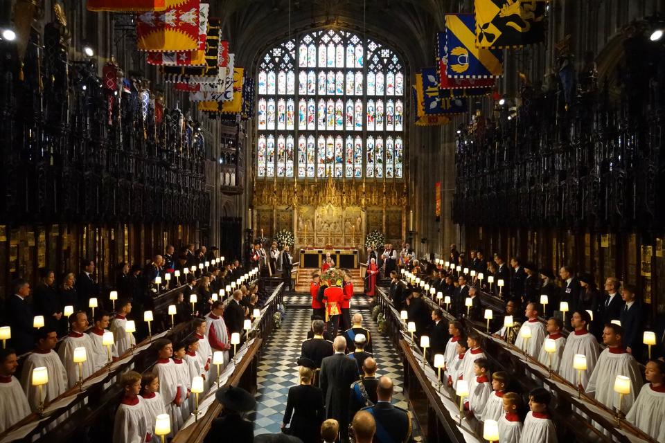 King Charles III and members of the royal family follow behind the coffin of Queen Elizabeth II as it is carried into St George’s Chapel in Windsor Castle. (PA)