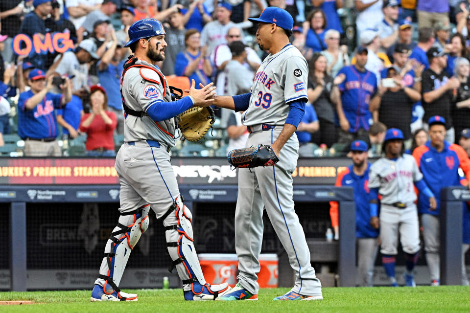 September 29, 2024; Milwaukee, Wisconsin, USA; New York Mets outfielder Harrison Bader (44) and New York Mets pitcher Edwin Díaz (39) celebrate a 5-0 victory over the Milwaukee Brewers at American Family Field. Mandatory credits: Michael McLoone-Imagn Images