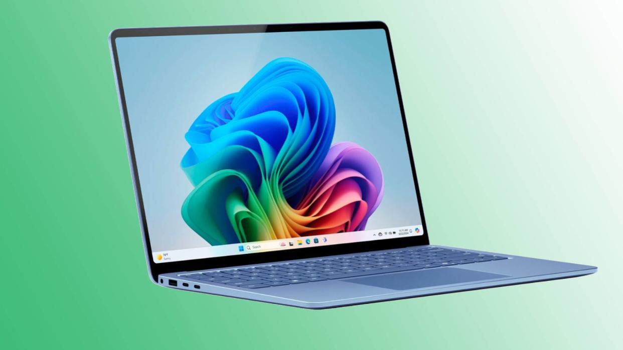  Blue Surface Laptop 7 against green gradient background. 