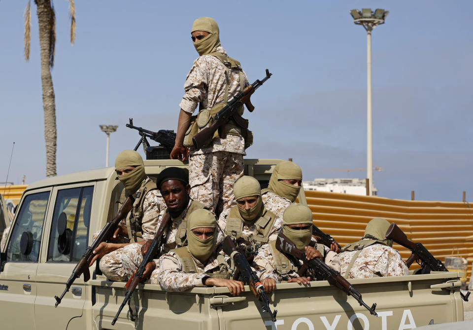 Forces loyal to Abdul Hamid Dbeibah, one of Libya’s two rival prime ministers, secure the streets of the capital, Tripoli, Tuesday May, 17, 2022. Clashes broke out in Tripoli after Dbeibah’s rival, Prime Minister Fathi Bashagha, announced his arrival in the city on Tuesday morning. But Bashagha left soon after the fighting started. (AP Photo/Yousef Murad)