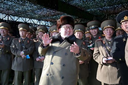 North Korean leader Kim Jong Un smiles while watching the Korean People's Army (KPA) tank crews' competition at an unknown location, in this undated photo released by North Korea's Korean Central News Agency (KCNA) in Pyongyang on March 11, 2016. REUTERS/KCNA