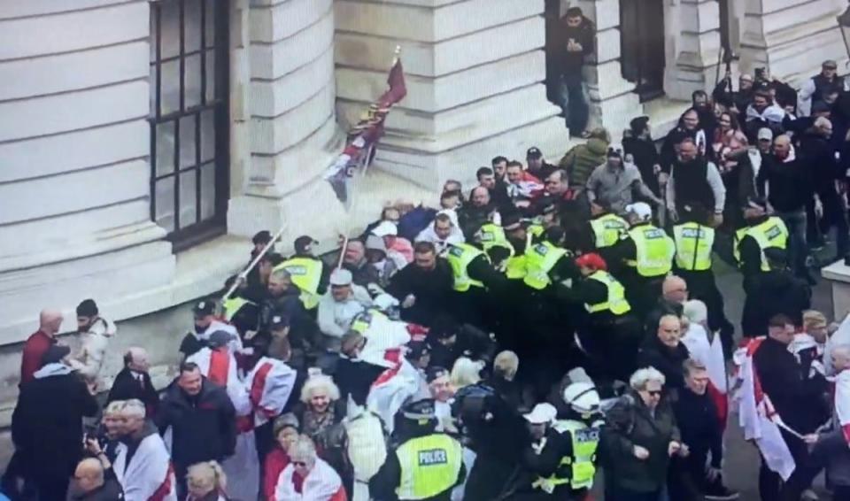 Activists storm past to get out of agreed parade area (@metpoliceuk/X)