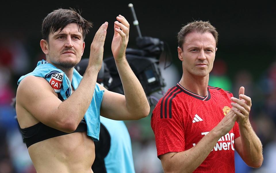 Harry Maguire and Jonny Evans walk off after a pre-season friendly against Athletic Bilbao - Manchester United set to hand Jonny Evans a deal - raising fresh doubts over Harry Maguire