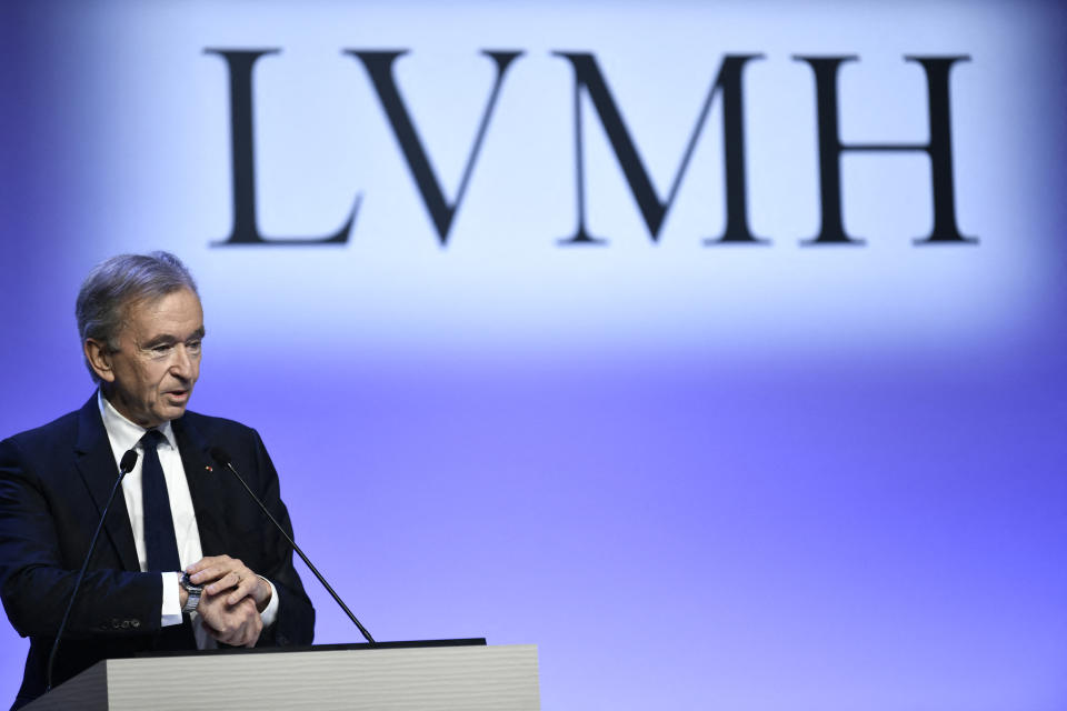 World's top luxury group LVMH head Bernard Arnault delivering a speech with the LVMH logo in the background, illustrating a story on the 2024 Forbes Billionaires List.