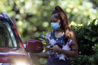 Charmaine Turner prepares to enter a viewing her for 8-year-old daughter Secoriea Turner, who was fatally shot in Atlanta on July 4th near the Wendy's site where Rayshard Brooks was killed the previous month Tuesday, July 14, 2020, in South Fulton, Ga. (AP Photo/John Bazemore)