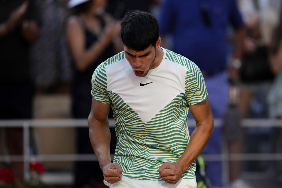 Spain's Carlos Alcaraz celebrates after beating Italy's Lorenzo Musetti during their fourth round match of the French Open tennis tournament at the Roland Garros stadium in Paris, Sunday, June 4, 2023. (AP Photo/Thibault Camus)
