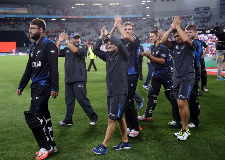 New Zealand players thank their fans after their victory in the semi-final Cricket World Cup match between New Zealand and South Africa at Eden Park in Auckland on March 24, 2015