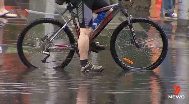 Cyclists were not to be deterred and braved the treacherous conditions. Source: 7 News