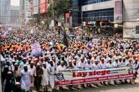 Supporters and activists of the Islami Andolan Bangladesh take part in a protest calling for the boycott of French products and to denounce the French President Emmanuel Macron for his comments over a cartoon of Prophet Mohammad in Dhaka