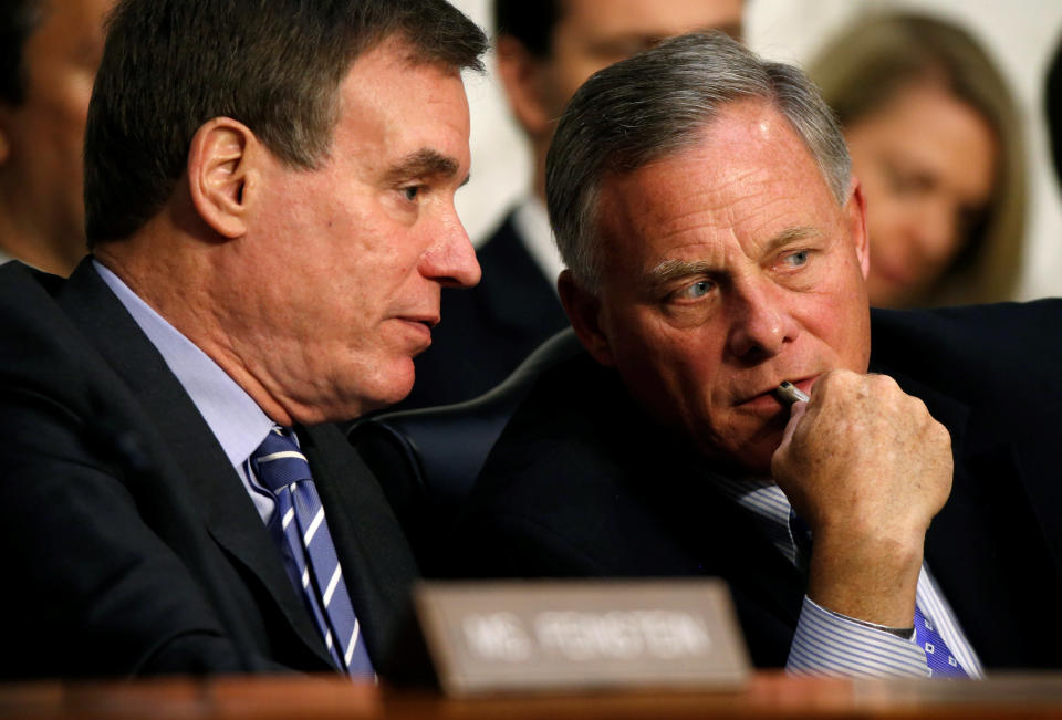 Chairman of the Senate Intelligence Committee Richard Burr (R-NC) and ranking member Mark Warner (D-VA) talk during a hearing about Russian interference in U.S. elections in Washington, U.S., June 21, 2017. REUTERS/Joshua Roberts