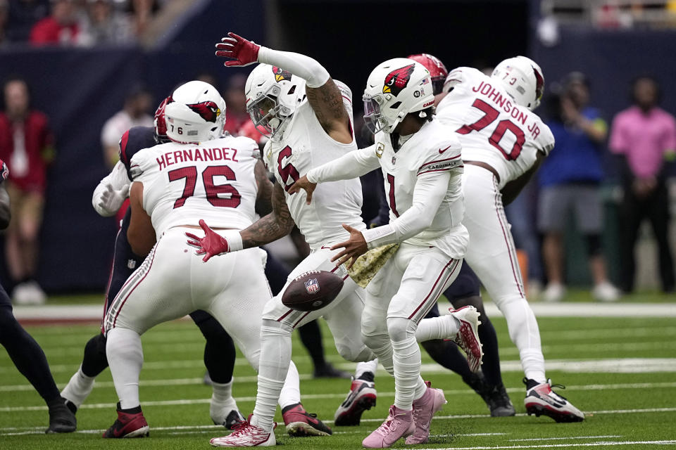 Arizona Cardinals quarterback Kyler Murray (1) fumbles the ball after colliding with James Conner (6) in the first half of an NFL football game against the Houston Texans in Houston, Sunday, Nov. 19, 2023. Conner recovered the fumble on the play. (AP Photo/David J. Phillip)