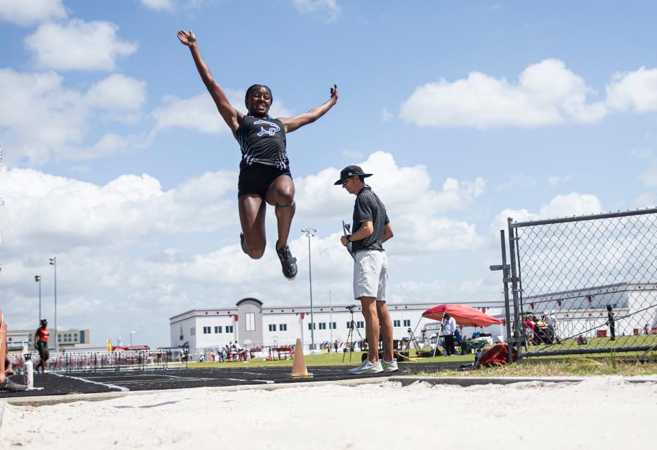 Shamoya Clemetson of Barron Collier competes in the long jump at the FHSAA Class 3A District-12 track and field meet at South Fort Myers High School on Saturday, April 23, 2022. She won. 