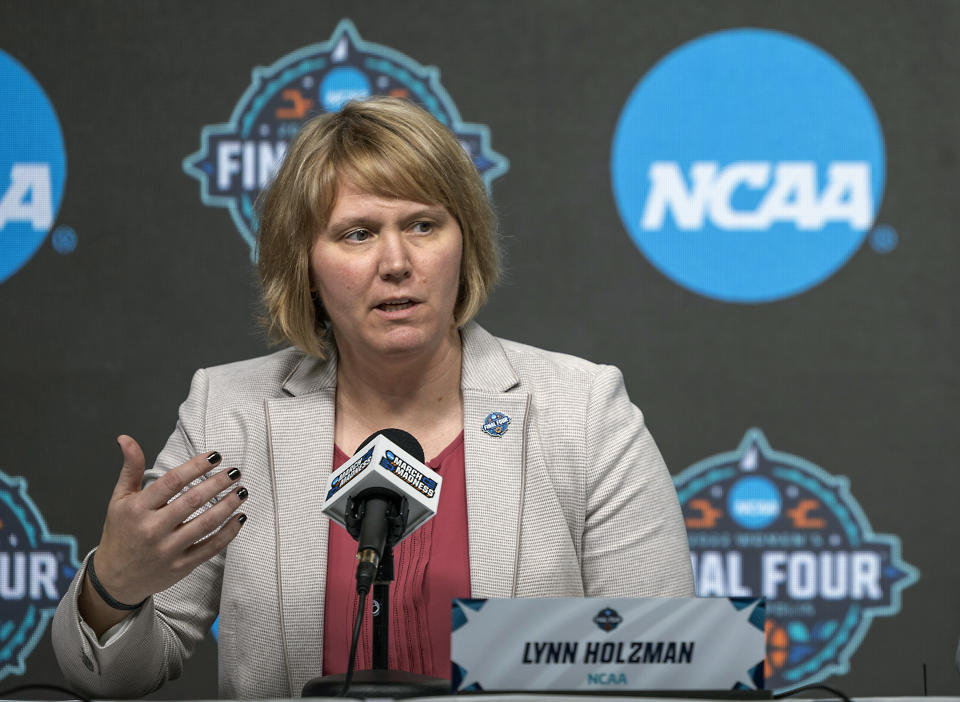 FILE - Lynn Holzman, NCAA vice president for women's basketball, speaks during a news conference Wednesday, March 30, 2022, in Minneapolis. The NCAA women's basketball tournament has so far been the most successful its ever been in regards to attendance and viewership. Still a few problems have arisen off the court that have taken away a bit from the success. (Elizabeth Flores/Star Tribune via AP, File)