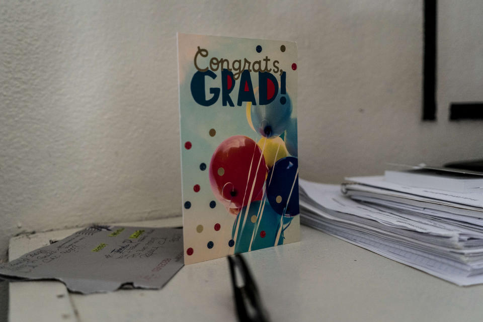 A card celebrating Jamal Lewis's graduation is seen in his cell at Folsom State Prison in Folsom, Calif., Thursday, May 25, 2023. Lewis earned his bachelor's degree in communications through the Transforming Outcomes Project at Sacramento State. (AP Photo/Jae C. Hong)