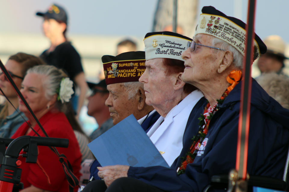 Pearl Harbor survivors and other military veterans observe a ceremony on Wednesday, Dec . 7, 2022 in Pearl Harbor, Hawaii in remembrance of those killed in the 1941 attack. A handful of centenarian survivors of the attack on Pearl Harbor gathered at the scene of the Japanese bombing on Wednesday to commemorate those who perished 81 years ago. (AP Photo/Audrey McAvoy)