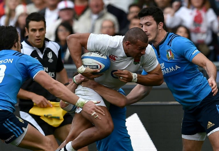 England's centre Jonathan Joseph (C) runs with the ball during the Six Nations match against Italy at Rome's Olympic stadium on February 14, 2016