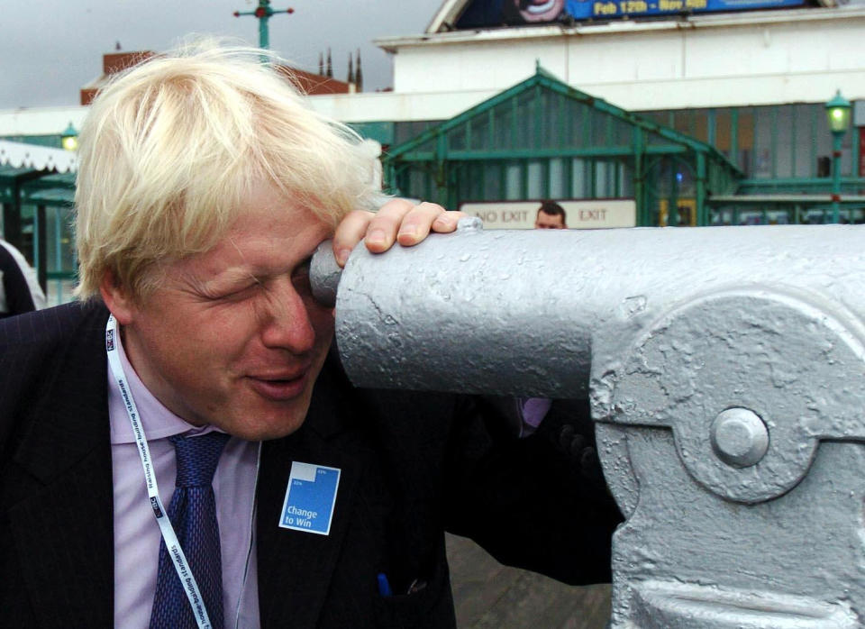 Boris Johnson the Conservative MP for Henley looks through a telescope on the North Pier at Blackpool, Monday 3 October 2005 on the first day of the Conservative Conference. Colourful Tory MP Boris Johnson today said he found the idea that Gordon Brown could defeat any leader of the Conservative Party in a General Election "absolutely unbelievable". The member for Henley and Spectator editor, who is backing David Cameron's leadership bid, said that he was not in favour of would-be leaders trying to mimic Tony Blair but called for a new approach to Conservatism. Speaking at a conference fringe meeting, he predicted success for the Tories next time the country goes to polls. He said: "I think the Tories are going to win the next election. See PA Story TORY Boris. PRESS ASSOCIATION Photo. Photo credit should read: PA.