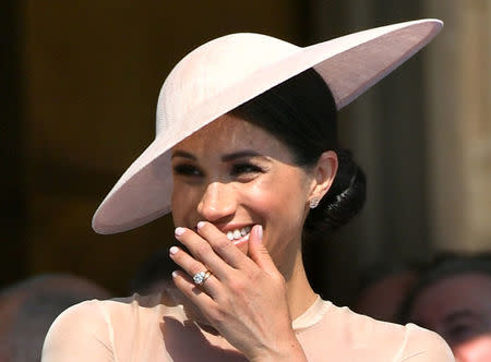 FILE PHOTO: Meghan, Duchess of Sussex attends a garden party at Buckingham Palace, in London, Britain May 22, 2018. Dominic Lipinski/Pool via Reuters