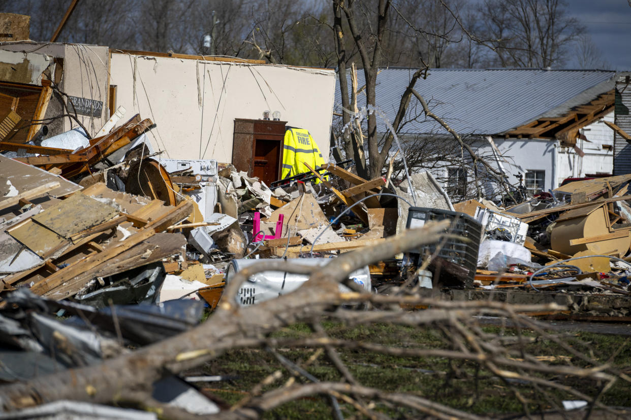 Damage from a late-night tornado is seen in Sullivan, Ind., Saturday, April 1, 2023. Multiple deaths were reported in the area following the storm. (AP Photo/Doug McSchooler)