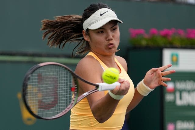 Emma Raducanu, of Britain, returns a shot to Magda Linette, of Poland, at the BNP Paribas Open tennis tournament on Saturday