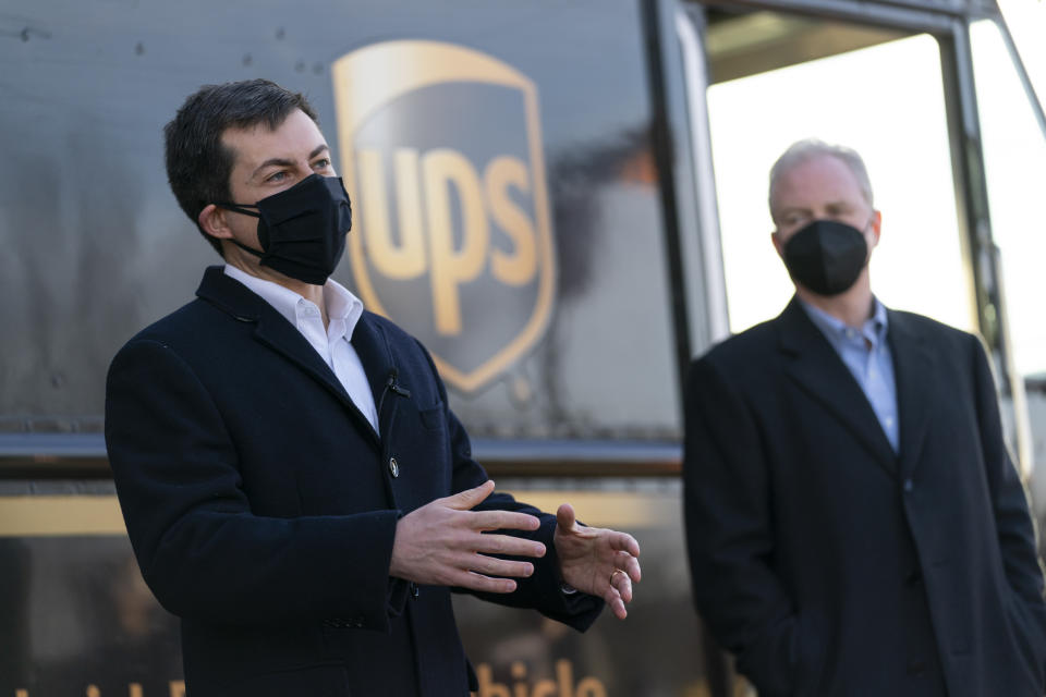 Transportation Secretary Pete Buttigieg, joined by Sen. Chris Van Hollen, D-Md., speaks to media after touring a UPS Facility in Landover, Md., Monday, March 15, 2021. Buttigieg was on hand to highlight COVID-19 vaccine distribution distribution efforts. (AP Photo/Carolyn Kaster)