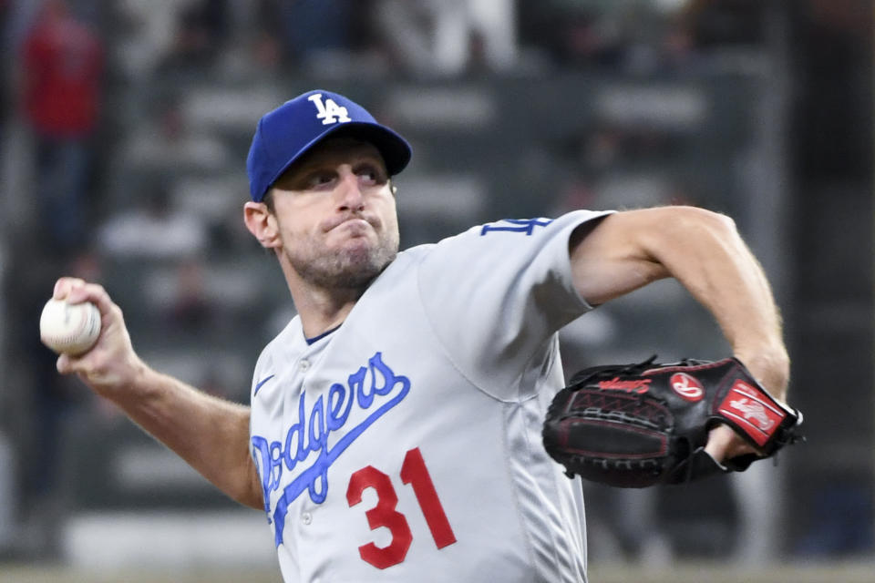 Atlanta, GA - October 17: Los Angeles Dodgers starting pitcher Max Scherzer delivers a pitch during the third inning in game two in the 2021 National League Championship Series against the Atlanta Braves at Truist Park on Sunday, Oct. 17, 2021 in Atlanta, GA.(Wally Skalij / Los Angeles Times via Getty Images)