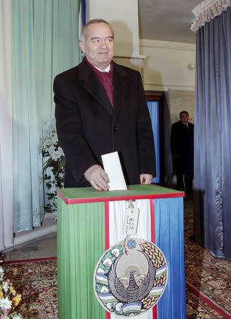 Uzbekistan's President Islam Karimov casts his ballot during a presidential election in Tashkent, Uzbekistan, January 9, 2000. Picture taken January 9, 2000. REUTERS/Shamil Zhumatov/File Photo