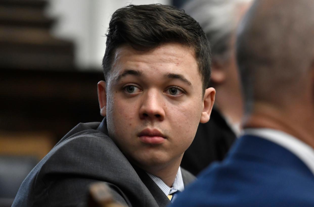 Kyle Rittenhouse looks back as attorneys discuss items in the motion for mistrial presented by his defense at the Kenosha County Courthouse in Kenosha, Wis., on Wednesday, Nov. 17, 2021.