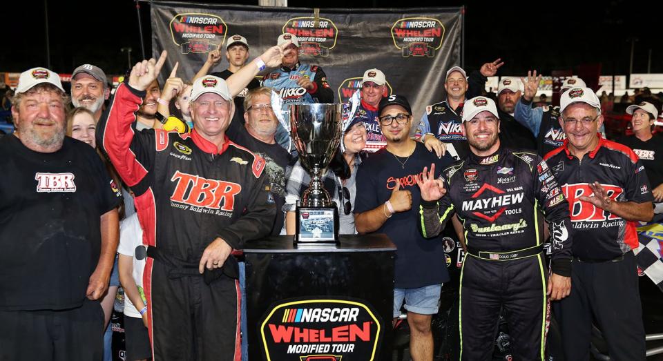 Doug Coby, driver of the #7 John Blewett Inc. Modified celebrates winning the CheckeredFlag.com 150 for the NASCAR Whelen Modified Tour at Larry King Law\