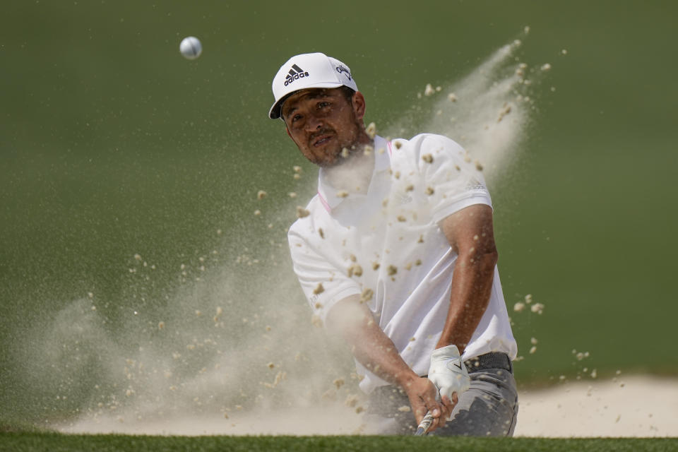 Xander Schauffele hits out of a bunker on the second hole during the final round of the Masters golf tournament on Sunday, April 11, 2021, in Augusta, Ga. (AP Photo/Matt Slocum)