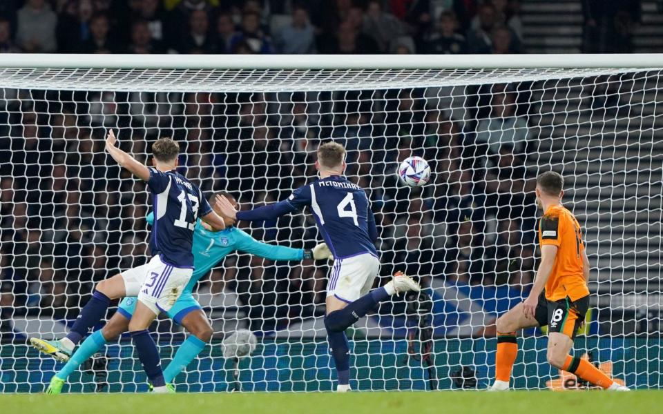 Hendry gets Scotland back in the game with his well-taken header - PA