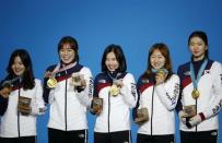 Medals Ceremony - Short Track Speed Skating Events - Pyeongchang 2018 Winter Olympics - Women's 3000 m - Medals Plaza - Pyeongchang, South Korea - February 21, 2018 - Gold medalists Shim Sukhee, Minjeong Choi, Kim Alang and Kim Yejin of South Korea on the podium. REUTERS/Kim Hong-Ji