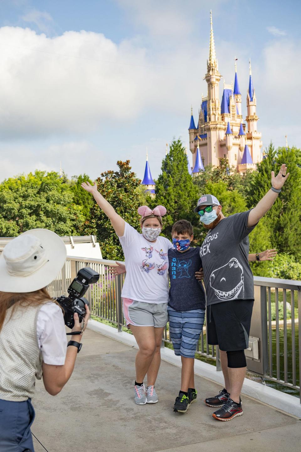 Guests stop to take a photo at Magic Kingdom Park at Walt Disney World Resort on July 11, 2020 in Lake Buena Vista, Florida. July 11, 2020 is the first day of the theme park’s phased reopening.Photo by Matt Stroshane/Walt Disney World Resort via Getty Images