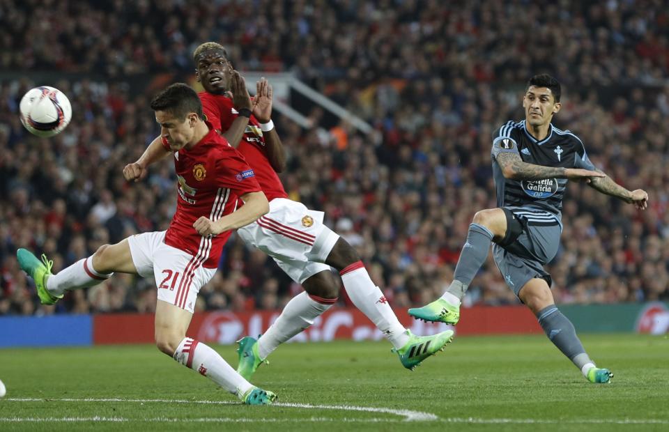 <p>Celta’s Pablo Hernandez, right, shoots at goalduring the Europa League semifinal second leg soccer match between Manchester United and Celta Vigo at Old Trafford </p>