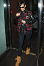 <b>Tartan trend:</b> Rihanna wraps up warm in the chill with a plaid sports jacket.