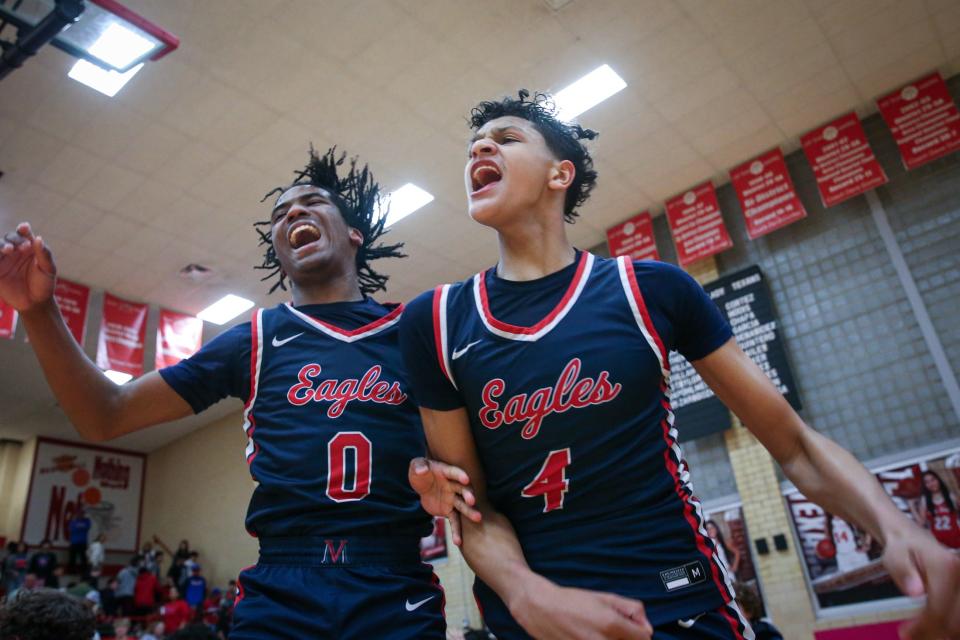 Veterans Memorial's CJ Perry (0) and Billy White III (4) celebrate winning the District 29-5A championship on Tuesday, Feb. 13, 2024, in Corpus Christi, Texas.