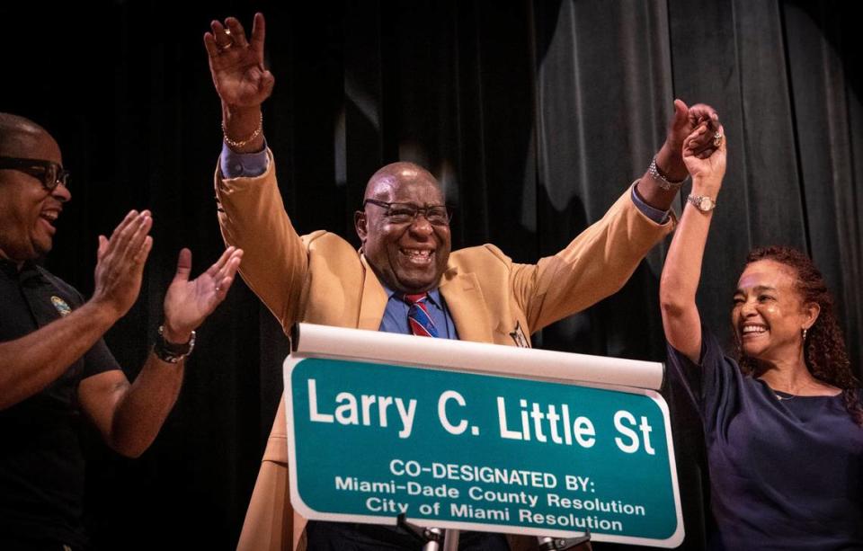 Larry Little, center, and Miami Dade County Commissioner Keon Hardemon and Miami City Commissioner Christine King, right, celebrate after the Larry C. Little street sign was unveiled during a street naming ceremony held at the Booker T. Washington High School auditorium on March 27. Friends, former teammates and elected officials attended the ceremony. Northwest 14th Street between Seventh Avenue and First Avenue is now “Larry C. Little Street.”