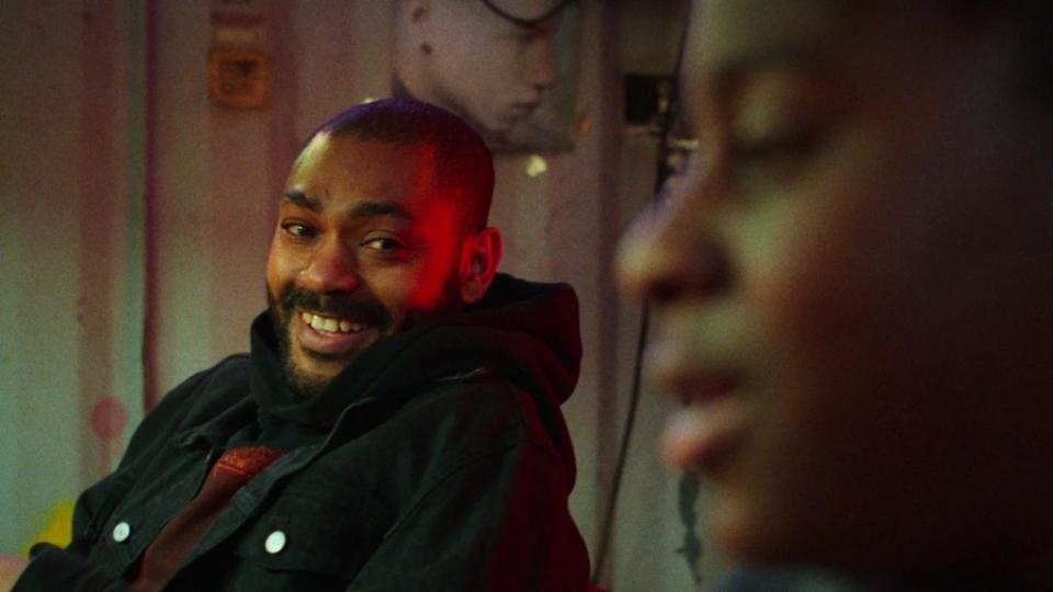 Kane Robinson smiles in Netflix's "The Kitchen"