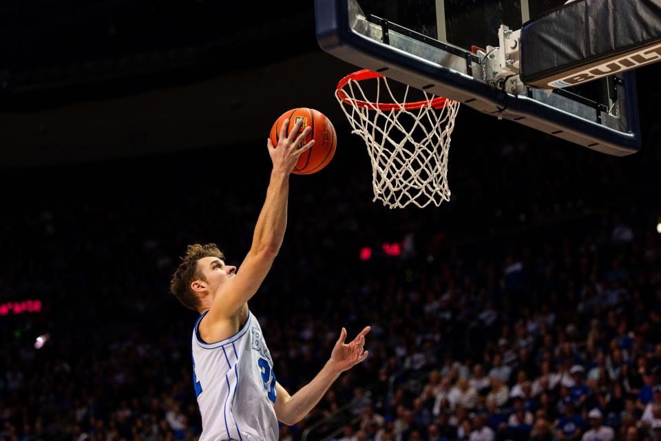 Brigham Young Cougars guard Trevin Knell (21) shoots a layup during a men’s college basketball game between Brigham Young University and Baylor University at the Marriott Center in Provo on Tuesday, Feb. 20, 2024. | Megan Nielsen, Deseret News