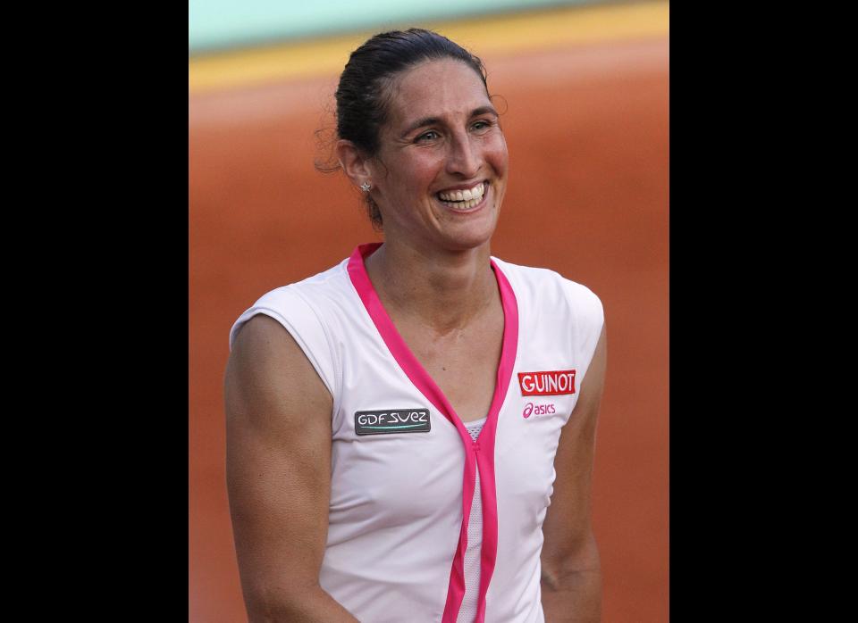 France's Virginie Razzano reacts after winning over US Serena Williams hits a return to during their Women's Singles 1st Round tennis match of the French Open in Paris.      (Photo credit should read PATRICK KOVARIK/AFP/GettyImages)