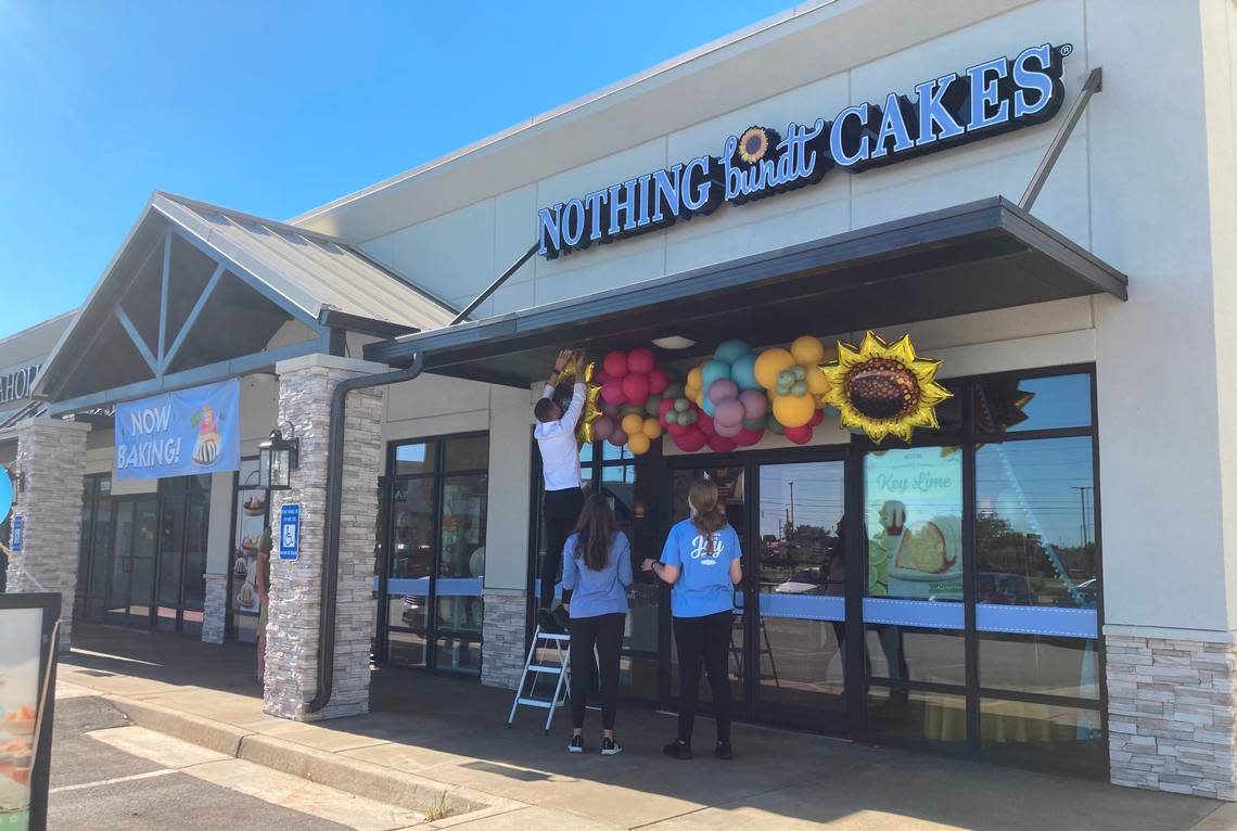 Finishing touches are put in place July 16 just before the opening of Nothing Bundt Cakes at 810 Ga. 96, Suite 1400, in the Century Market Plaza in Warner Robins.