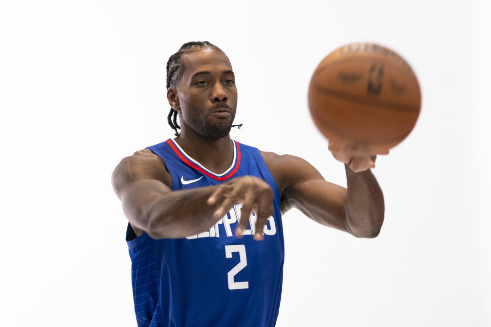 Los Angeles Clippers forward Kawhi Leonard poses for photos during the NBA basketball team's media day Monday, Oct. 2, 2023, in Los Angeles. (AP Photo/Jae C. Hong)