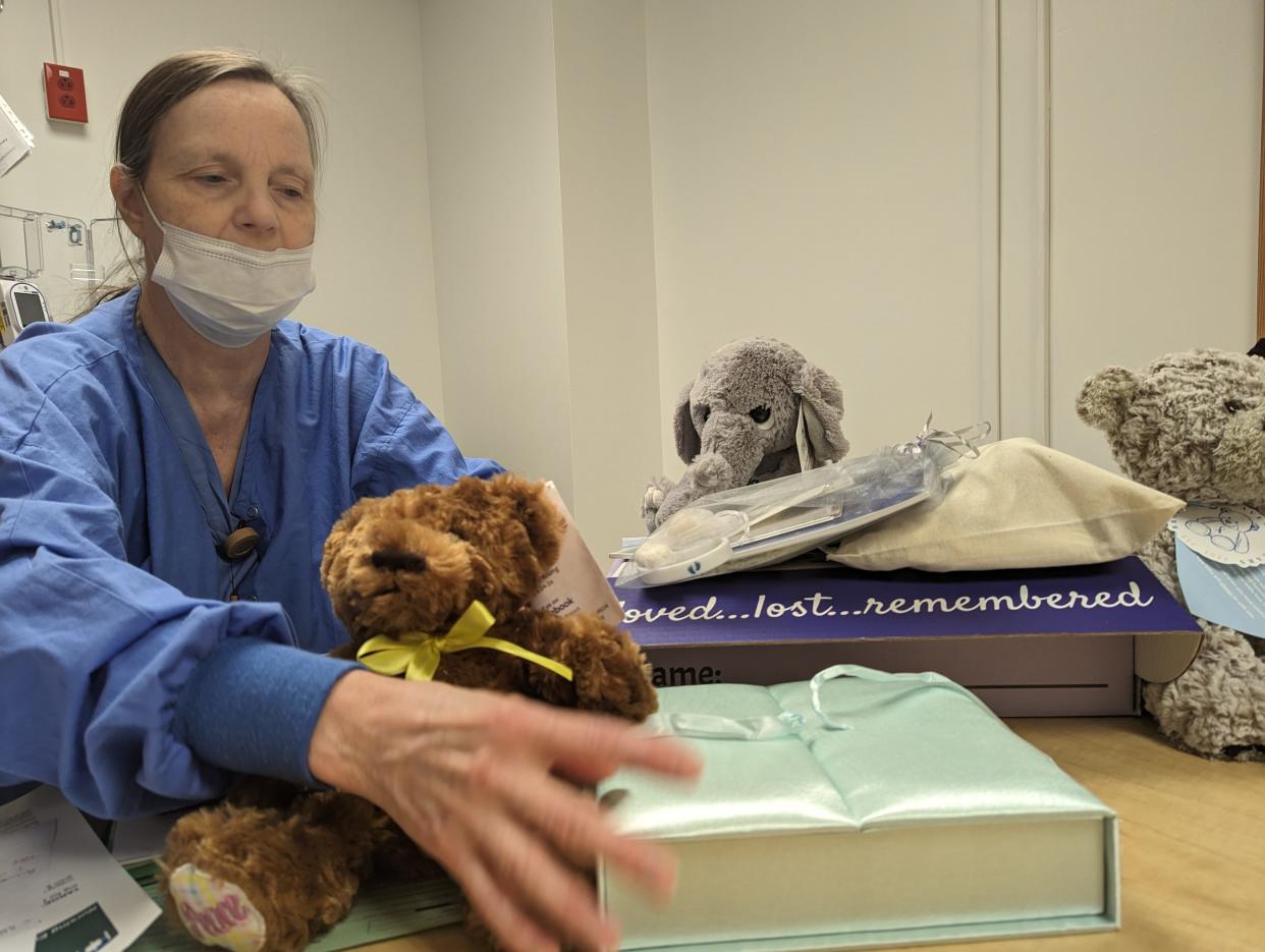 Nurse Linda Heitger is the perinatal-loss educator at Cleveland Clinic Mercy Hospital in Canton. She trains staff and educates families on how to deal with miscarriages and infant loss. She shows one of the care packages they give to families from Forget Me Not Baskets of Wooster.