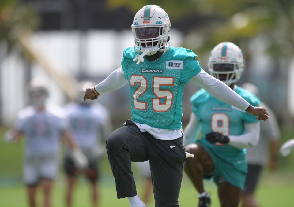 Dolphins cornerback Xavien Howard stretches before Wednesday's practice at Baptist Health Training Complex.