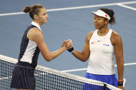 Karolina Pliskova of the Czech Republic, left, is congratulated by Naomi Osaka of Japan, right, after Pliskova won her semifinal match 6-7, 7-6, 6-2, at the Brisbane International tennis tournament in Brisbane, Australia, Saturday, Jan. 11, 2020. (AP Photo/Tertius Pickard)