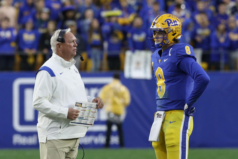 Pittsburgh quarterback Kenny Pickett (8) celebrates with head coach Pat  Narduzzi after scoring a touchdown in the second half of an NCAA college  football game, Friday, Nov. 24, 2017, in Pittsburgh. Pittsburgh